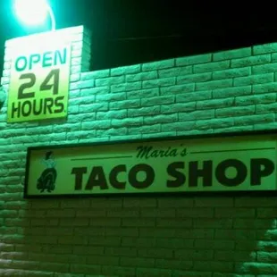 a neon sign for the restaurant