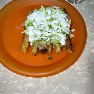 This looks like rolled tacos &amp; water bottle