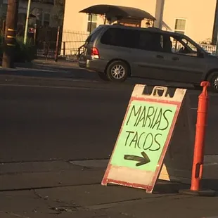 a sign on the side of the road