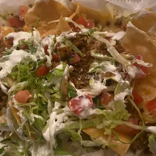 Everything nachos with ground beef (you choose your meat). Yum!