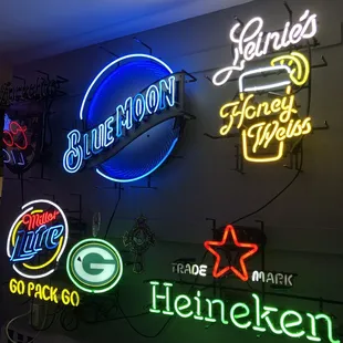 a variety of neon signs