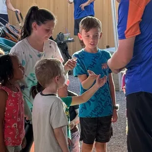 James Reid giving out his trading cards and stickers after a stage show at the 2024 Maricopa County Fair.