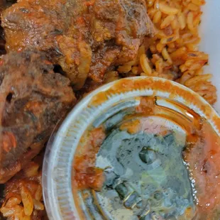 Jollof rice with chicken and beef. Spinach is in the plastic container