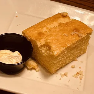 a piece of cake and a bowl of cream