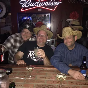 a group of people sitting at a bar