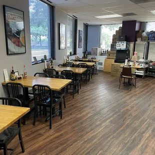 a dining area with tables and chairs