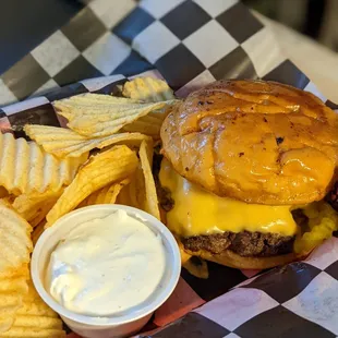 a cheeseburger and chips