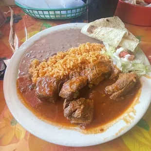 Costillas de Puerco, rice, beans and a  homemade flour tortilla.