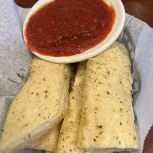 a bowl of sauce and tortillas