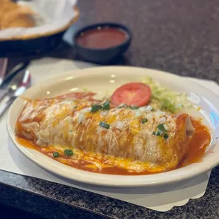 Beef and bean burrito, with enchilada sauce