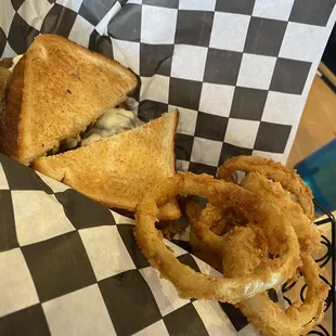 Grilled cheese burger and onion rings.