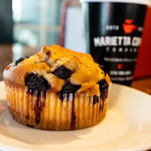 a blueberry muffin on a plate