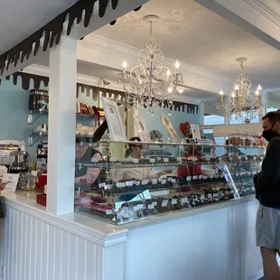 a man and a woman standing in front of a counter