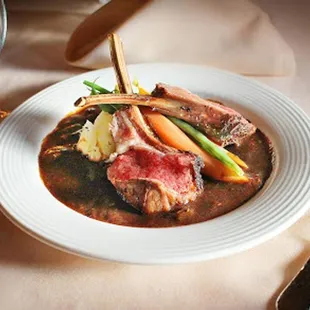 a plate of meat and vegetables