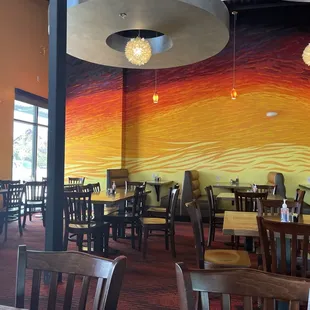 Colorful wall and window looking out onto a parking lot with plenty of parking available shared by Cabela&apos;s.