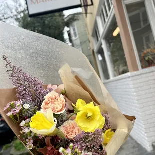a person holding a bouquet of flowers