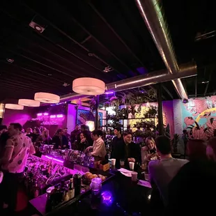 a large group of people at a bar