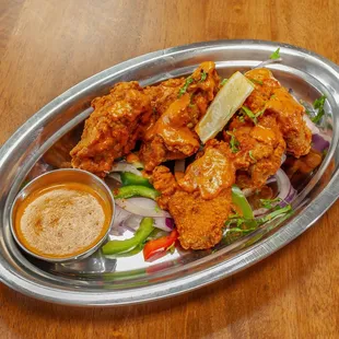 Crispy fried wings, slathered in house special sauce