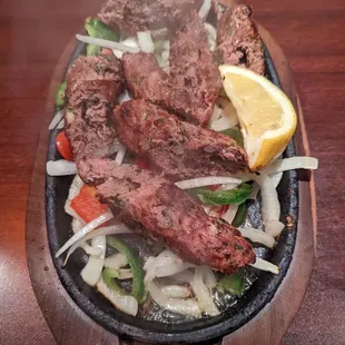 a plate of meat and vegetables