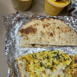 CURRIES, LEFT: Mixed Vegetable Korma RIGHT: Chicken Tikka Masala  TOP: Plain Naan BOTTOM: Garlic Naan