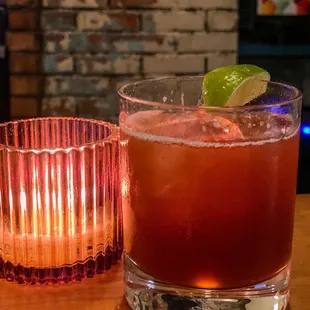 a close up of a drink and a candle