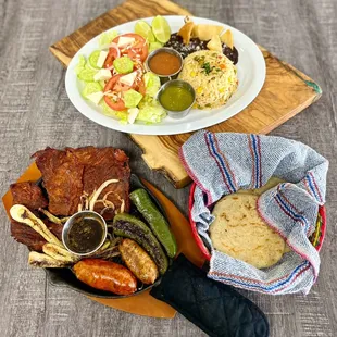 a plate of meat, rice, and vegetables