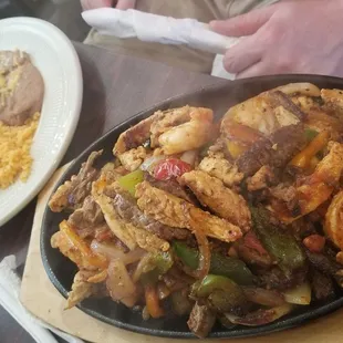 Fajitas with steak, chicken, and shrimp