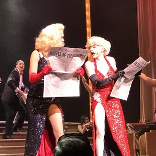 a group of dancers performing on stage