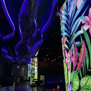 a brightly lit tropical themed restaurant