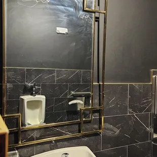 a sink and mirror in a bathroom