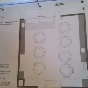 Room c default layout with round tables.  Seats 70 persons.