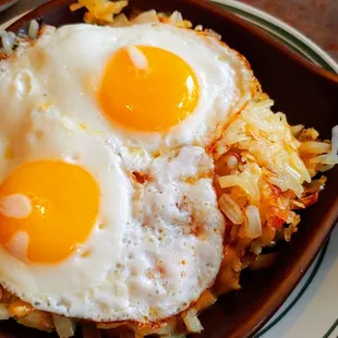 Wisconsin Cheese Skillet with eggs sunny side up. Tasty.
