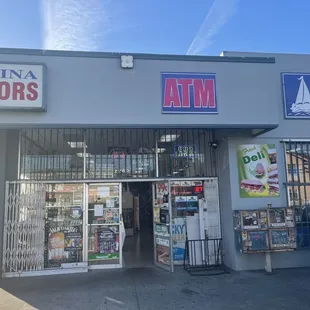 the entrance to marina liquors