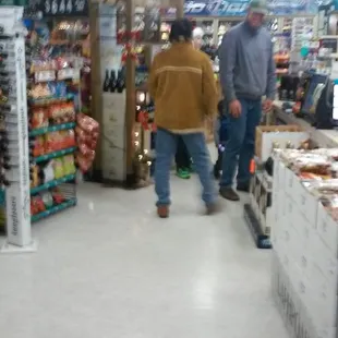 two men walking through the store