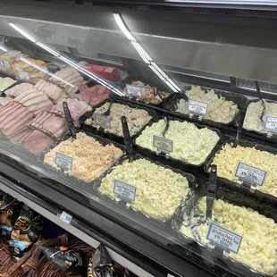 a variety of meats in a display case