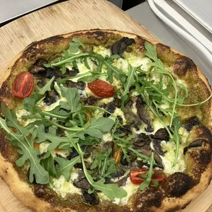 a pizza on a cutting board