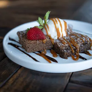 Home-made brownies with vanilla ice cream, caramel drizzle