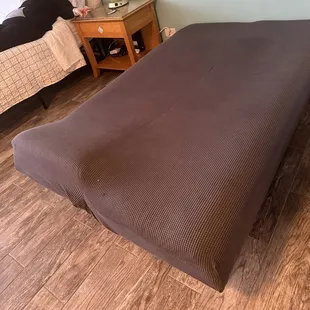 This dirty lumpy mattress with no sheets no pillows and no blankets. It was covered in stains and food crumbs.