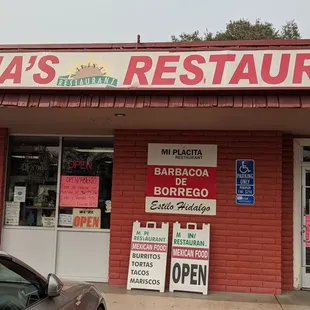 a car parked in front of the restaurant