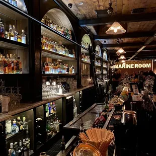 the bar with many bottles of liquor