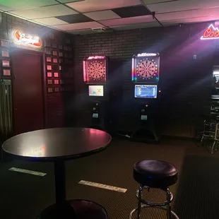 a table and stool in a dimly lit room