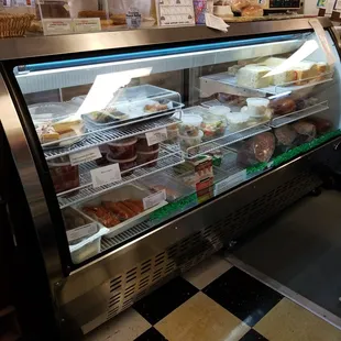 a display case filled with pastries
