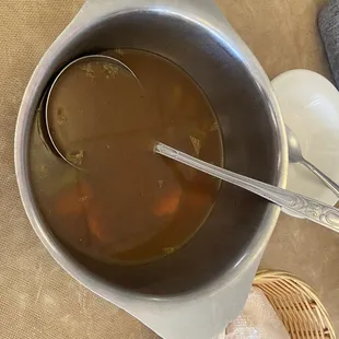 a bowl of soup and bread
