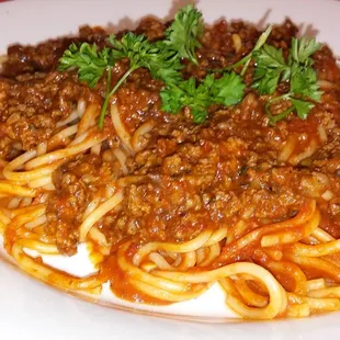 a plate of spaghetti and meat