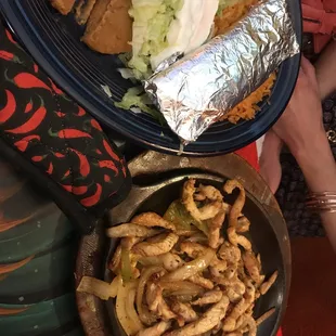 a plate of food and a bowl of fries