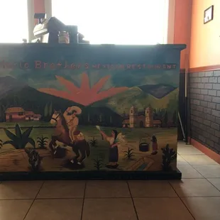 a mural of a man riding a horse