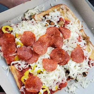 a slice of pepperoni and cheese pizza