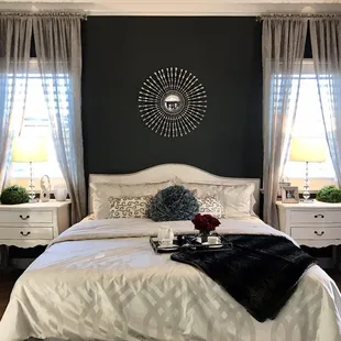 A very small master bedroom. But they managed to make it look very very nice, using lighter colors helps make the place look a little bigger