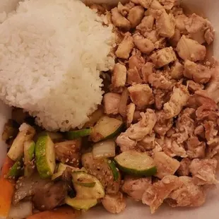 chicken and rice in a styrofoam container