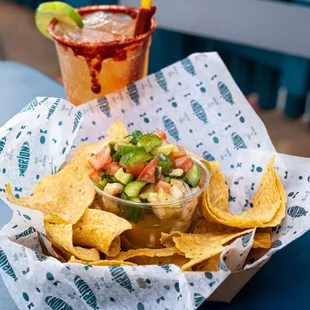  plate of nachos and a drink